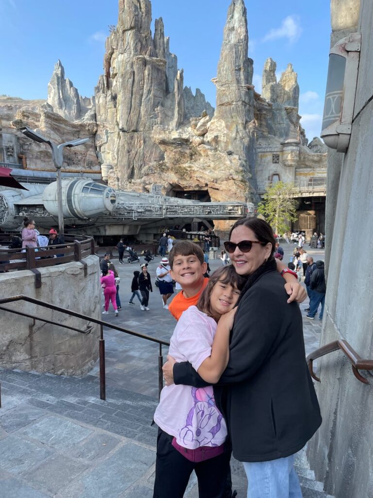 grandma and 2 kids in starwars land in disneyland
